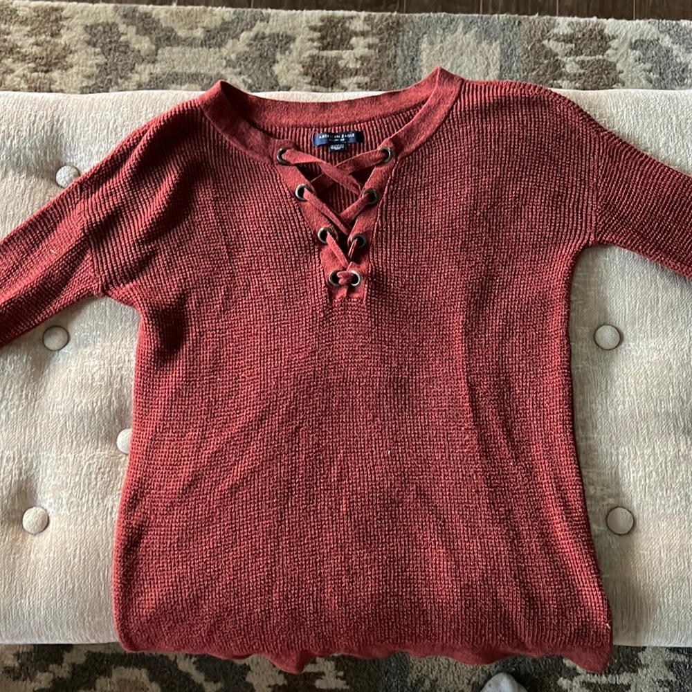 Rust colored knit V-neck sweater